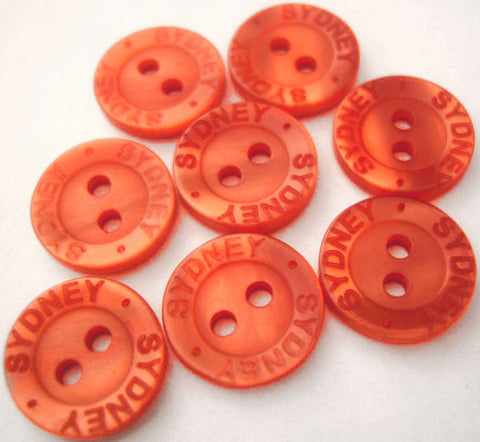 B2632 13mm Burnt Orange Polyester 2 Hole Button, Lettered Rim "SYDNEY"